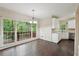Dining area featuring hardwood floors, large windows, and stainless steel appliances at 2650 Wendell Creek Ln, Snellville, GA 30039