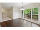 Hardwood-floored dining area with access to a deck through large windows at 2650 Wendell Creek Ln, Snellville, GA 30039
