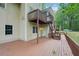 The back of this house shows a wooden deck with an external staircase, leading to an upper floor at 2650 Wendell Creek Ln, Snellville, GA 30039