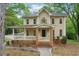 Charming two-story home featuring a welcoming front porch and traditional architectural details at 2650 Wendell Creek Ln, Snellville, GA 30039