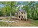 Two-story home with a welcoming front porch, landscaping, and classic design at 2650 Wendell Creek Ln, Snellville, GA 30039