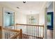 Hallway with hardwood floors, natural light, and staircase at 2650 Wendell Creek Ln, Snellville, GA 30039