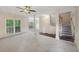 Large living room with a fireplace and neutral carpet, perfect for entertaining guests at 2650 Wendell Creek Ln, Snellville, GA 30039