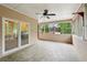 Screened porch with ceiling fan, perfect for enjoying views of the trees and neighborhood at 2650 Wendell Creek Ln, Snellville, GA 30039