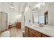 Double vanity bathroom with large mirror and tiled floor at 2656 White Rock Dr, Buford, GA 30519