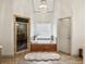 Bright bathroom with standalone shower, soaking tub, and neutral colors at 2656 White Rock Dr, Buford, GA 30519