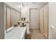 Bright bathroom featuring an extended vanity, a large mirror and plenty of storage space, creating a functional design at 2656 White Rock Dr, Buford, GA 30519
