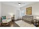 Bedroom with hardwood floors, crib, rocking chair, and natural light at 2656 White Rock Dr, Buford, GA 30519