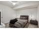 Modern bedroom features stylish furnishings, neutral tones, and soft carpet, creating a calming and inviting retreat at 2656 White Rock Dr, Buford, GA 30519