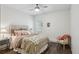Cozy bedroom featuring hardwood floors, accent chair, and natural light at 2656 White Rock Dr, Buford, GA 30519