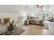 Spacious bedroom featuring modern decor, wood-look floors, ceiling fans and ample natural light, offering a serene retreat at 2656 White Rock Dr, Buford, GA 30519