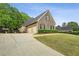 A well-maintained home with a spacious driveway and a lush green lawn at 2656 White Rock Dr, Buford, GA 30519