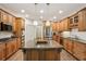 Gourmet kitchen with custom cabinets, granite countertops, and stainless steel appliances at 2656 White Rock Dr, Buford, GA 30519