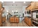 Well-equipped kitchen with wood cabinets, an island, and modern appliances at 2656 White Rock Dr, Buford, GA 30519