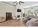Spacious living room featuring a fireplace, large windows, and ample seating at 2656 White Rock Dr, Buford, GA 30519
