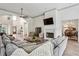 Bright living room with a fireplace, large windows, and an open layout at 2656 White Rock Dr, Buford, GA 30519