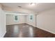 Finished basement featuring modern recessed lighting, sleek wood floors, and natural lighting at 2911 Allegro Nw Dr, Atlanta, GA 30318