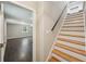 Finished basement featuring dark-stained flooring and a staircase at 2911 Allegro Nw Dr, Atlanta, GA 30318