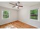 Charming bedroom with hardwood floors and two windows at 2911 Allegro Nw Dr, Atlanta, GA 30318
