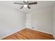 Bright bedroom with hardwood floors, a ceiling fan, and a closet at 2911 Allegro Nw Dr, Atlanta, GA 30318