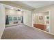 Spacious carpeted bedroom with neutral walls, and a view of a bathroom through a doorway at 2911 Allegro Nw Dr, Atlanta, GA 30318