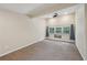 The bedroom has carpeted floors, a window with curtains, and natural light at 2911 Allegro Nw Dr, Atlanta, GA 30318