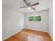 Cozy bedroom featuring hardwood floors, a ceiling fan, and a window with natural light at 2911 Allegro Nw Dr, Atlanta, GA 30318