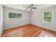 Inviting bedroom with hardwood floors and two large windows offering great natural light at 2911 Allegro Nw Dr, Atlanta, GA 30318