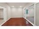 Bright living room features beautiful hardwood floors, neutral walls, and ample natural light at 2911 Allegro Nw Dr, Atlanta, GA 30318