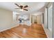 Bright living area with hardwood floors, ceiling fan, and view into updated kitchen at 2911 Allegro Nw Dr, Atlanta, GA 30318