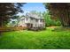 Large, well-maintained backyard featuring a deck, grassy area, and partial tree surround at 2930 Burnt Hickory Nw Rd, Marietta, GA 30064