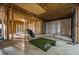 Partially finished basement area with golf simulation setup and concrete floor at 2930 Burnt Hickory Nw Rd, Marietta, GA 30064