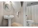 Small bathroom featuring a pedestal sink, toilet, and shower with curtain at 2930 Burnt Hickory Nw Rd, Marietta, GA 30064