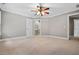 Spacious bedroom with neutral walls, crown molding, and adjacent bathroom at 2930 Burnt Hickory Nw Rd, Marietta, GA 30064
