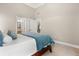 Bright bedroom with a large bed and a view of the backyard through large windows at 2930 Burnt Hickory Nw Rd, Marietta, GA 30064