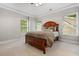 Bedroom with neutral walls, carpet flooring, ceiling fan, and a large window with a view of the trees at 2930 Burnt Hickory Nw Rd, Marietta, GA 30064