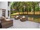 Outdoor deck with wicker furniture, a black railing, and a view of landscaped backyard at 2930 Burnt Hickory Nw Rd, Marietta, GA 30064