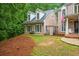 Charming front yard with brick accents, well-maintained lawn, and mature trees for privacy at 2930 Burnt Hickory Nw Rd, Marietta, GA 30064