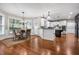 Bright breakfast nook with large windows, hardwood floors, and a view of the modern kitchen at 2930 Burnt Hickory Nw Rd, Marietta, GA 30064