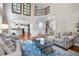 Open-concept living room featuring hardwood floors and views into kitchen and stairway at 2930 Burnt Hickory Nw Rd, Marietta, GA 30064