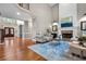 Spacious living room with fireplace, high ceilings, hardwood floors, and elegant decor at 2930 Burnt Hickory Nw Rd, Marietta, GA 30064