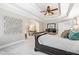 Cozy main bedroom with tray ceiling, carpet flooring, and a separate desk area at 2930 Burnt Hickory Nw Rd, Marietta, GA 30064