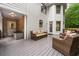 Spacious patio featuring cozy wicker furniture, a gray floor, and access to the home's entrance at 2930 Burnt Hickory Nw Rd, Marietta, GA 30064