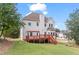 The backyard features a wooden deck perfect for outdoor entertaining and relaxing at 3113 Brians Creek Se Dr, Conyers, GA 30013
