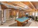Unfinished basement boasts a pool table and exposed ductwork overhead at 3113 Brians Creek Se Dr, Conyers, GA 30013