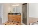 Bathroom featuring double vanity sinks and a large mirror, plus a glass shower at 3113 Brians Creek Se Dr, Conyers, GA 30013
