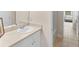 Bathroom featuring a single vanity and a view into the hallway and bedroom at 3113 Brians Creek Se Dr, Conyers, GA 30013