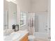 Well-lit bathroom featuring a vanity with a sink, a shower/tub combo, and neutral decor at 3113 Brians Creek Se Dr, Conyers, GA 30013