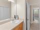 Bathroom featuring a single vanity and a view into the hallway and bedroom at 3113 Brians Creek Se Dr, Conyers, GA 30013