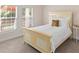 Bedroom with natural light, neutral carpet, and a stylish bed frame at 3113 Brians Creek Se Dr, Conyers, GA 30013